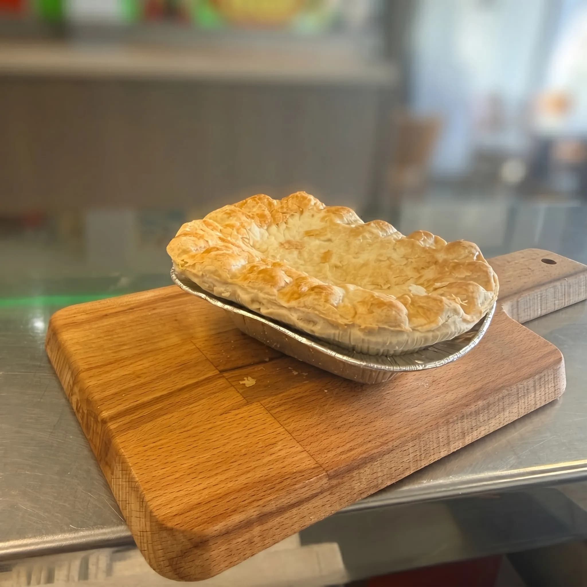 Stake & Kidney pie on wooden board